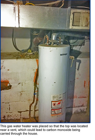 photo - This gas water heater was placed so that the top was located near a vent, which could lead to carbon monoxide being carried through the house.