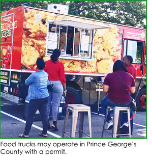 Food trucks are allowed in Prince George's County with a permit; customers lined up at food truck for lunch