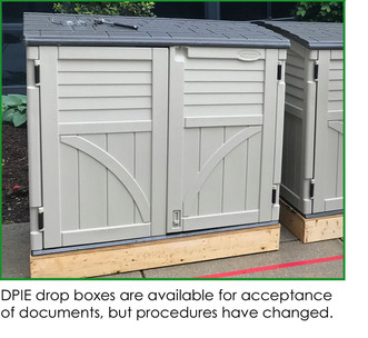 DPIE dropbox photo of small, tan, plastic sheds, are available for acceptance of documents, but procedures have changed.