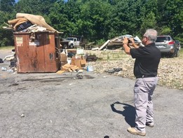 Sam Cappetta of the Enforcement Division investigates a property for possible zoning violations. 