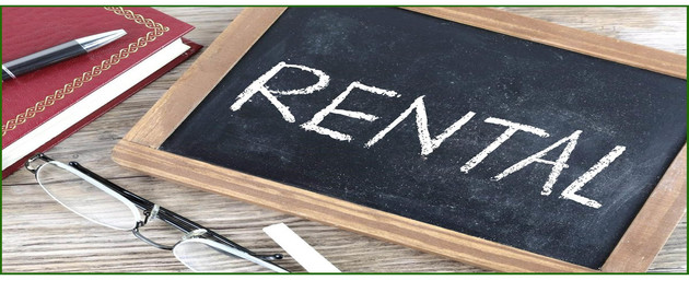 picture of RENTAL written on chalk board with notebook and pen