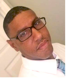 Demetrius Jones, white shirt, blue tie, glasses, November's employee of the month