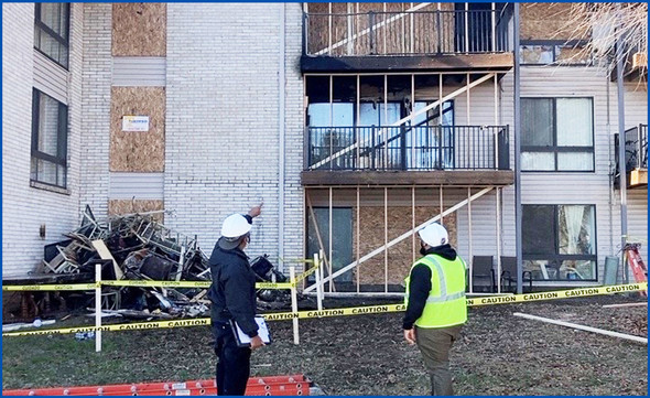 Inspectors review the fire damage to the Powder Mill apartments
