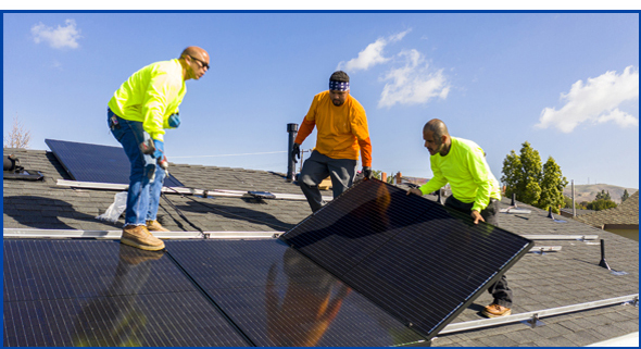 3 men on roof installing solar panels