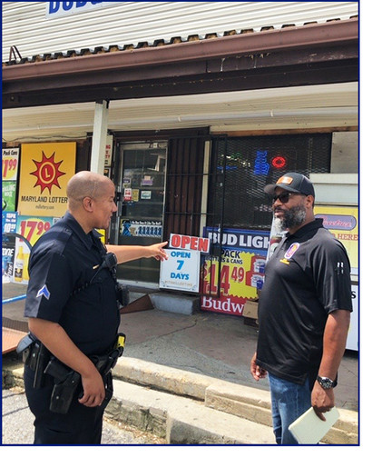 Enforcement Officer Brandon Wright and PG police officer at an inspection