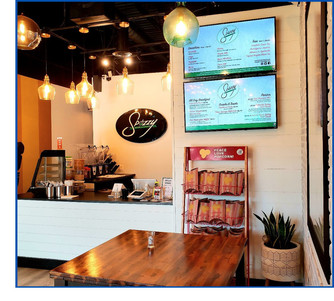 Spizzy counter for placing orders with their menu and logo