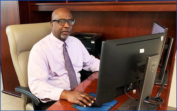 DPIE Deputy Director LaMont A. Hinton working at his desk