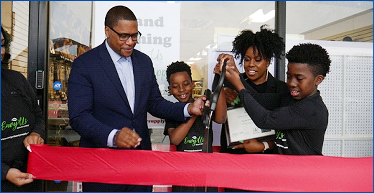 Envy US Beauty Supply, grand opening in Fort Washington, shows crowd at ribbon cutting