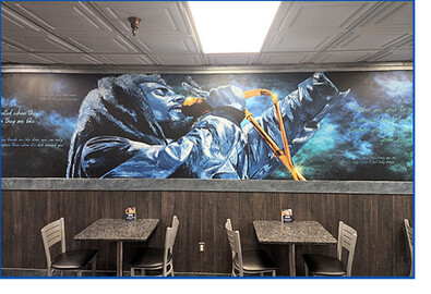 Blue Waters restaurant mural of singer printed in blues.
