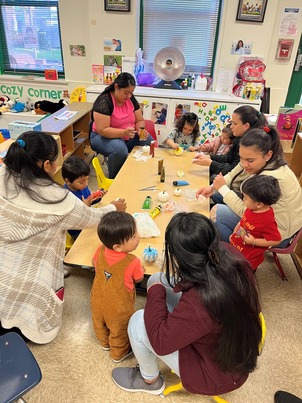 Mothers and their children doing arts and crafts