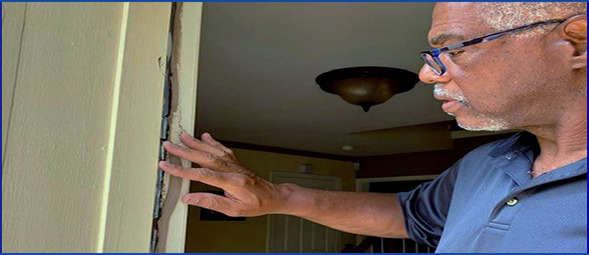 Winterize your home, resident checking door seal