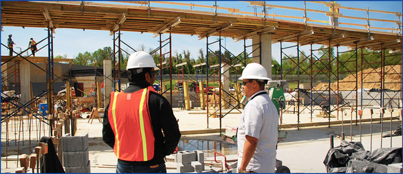DPIE inspector Joe Busby inspecting work on a construction site.