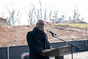 Jonathan Butler at the podium of the Highlands Groundbreaking Ceremony