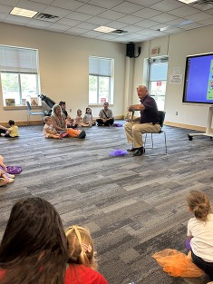 ed reading a book to kids