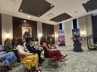 people in a room man at the podium