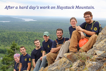 mcc trail crew resting on boulder field on Haystack Mt.