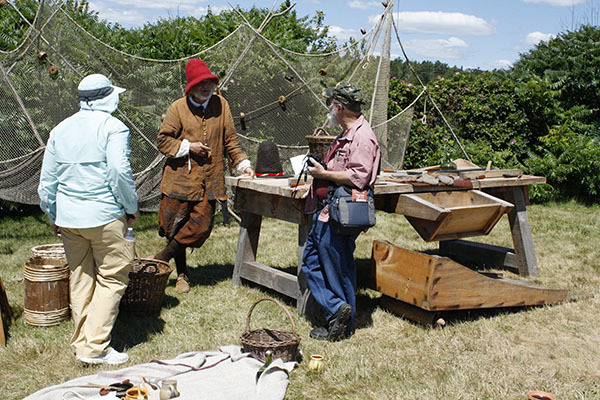 17th century fisherman/Paul Daiute speaking with visitors to 17th Century Encampment.