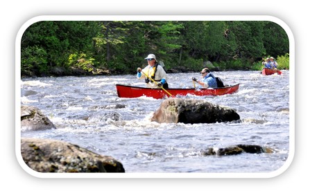 Paddlers at Chase Rapids on the Allagash Wilderness Waterway.