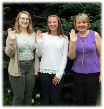 Three camping reservation staff waving goodbye for 2018 season.