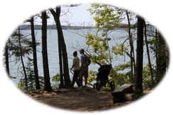 Shore hike along Casco Bay at Wolfe Neck Woods State Park; two hikers with stroller.