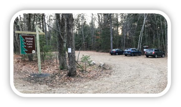 New River-Link Trailhead at Dodge Point Public Land showing entry sign and cars in newly completed lot.