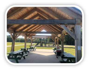 New Gloucester Fairgrounds Park project funded by LWCF. Covered pavilion and a playground shown.