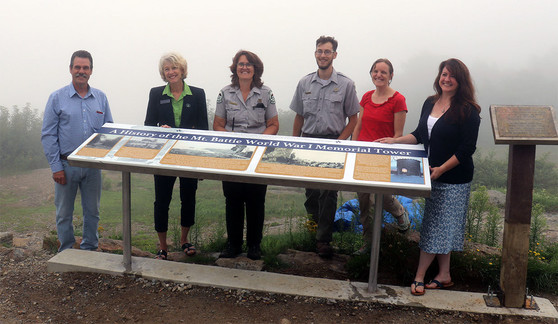 Unveiling of the Mount Battie Memorial History panel by those that worked on and supported it.