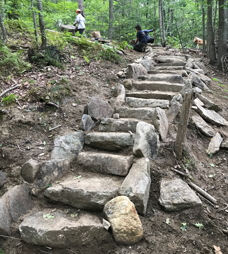 Stone steps being built at Dodge Point Public Land by a Maine Conservation Corps crew.