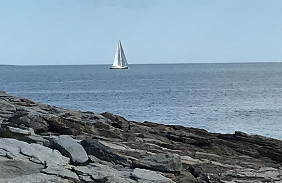 Small sailboat off shore of Reid State Park.