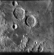 Moon showing two craters: Ritter and Sabine.