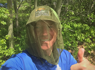 Andy Cutko, Maine Bureau of Parks and Lands Director, in a head net.