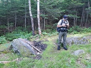 Maine Forest Service Ranger documenting camping damage on Tumbledown Mt.