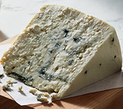 Cheese wedge cut to show blue veining.