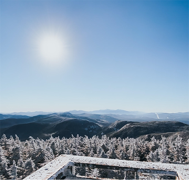 View of the mountain range from the top of the tower on Old Speck Mt. on a winter day.