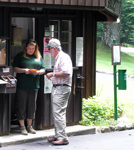 Will Harris, former Director of the Maine Bureau of Parks and Lands, helping out at a Maine State Park entry booth in 2014.