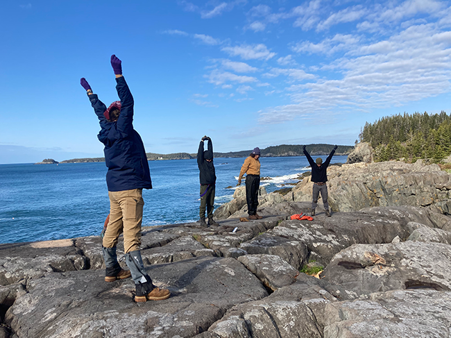 Maine Conservation Corps Team Leaders at their morning stretch circle at Cutler Coast Public Land.