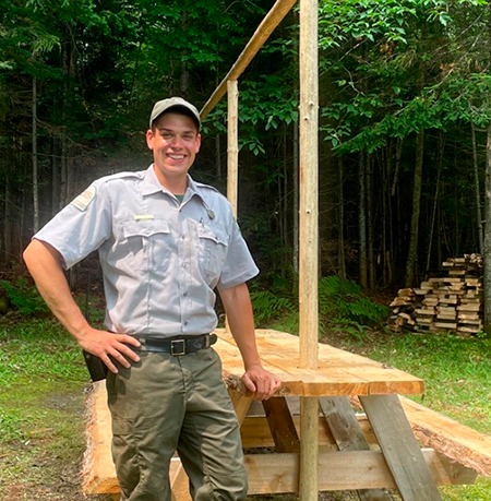 Cameron McIntosh, Assistant Ranger in the Allagash Wilderness Waterway at a waterway campsite.