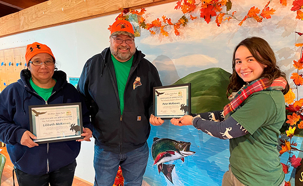 Lilibeth and Peter McKeown receive Volunteer Award at Mount Blue State Park presented by Park Naturalist Jamie Cantin.