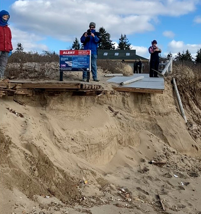 BPL staff on the remains of the boardwalk at Reid State Park after the January 2024 storms. 