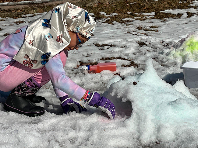 Snow shark being made by participant at the Bradbury Mt. State Park Winter Fun Day.