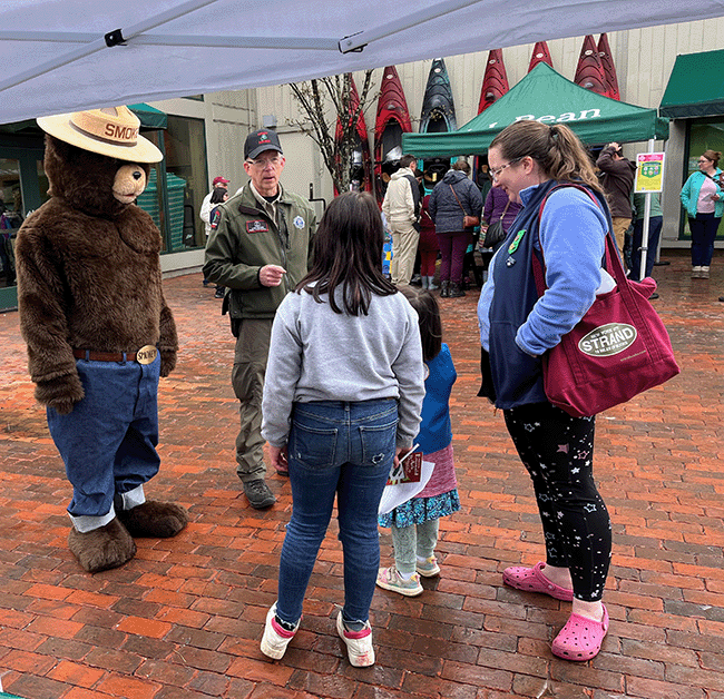 Smokey Bear visits the Green ME UP Festival sponsored by the Girl Scouts of Maine at L.L. Bean