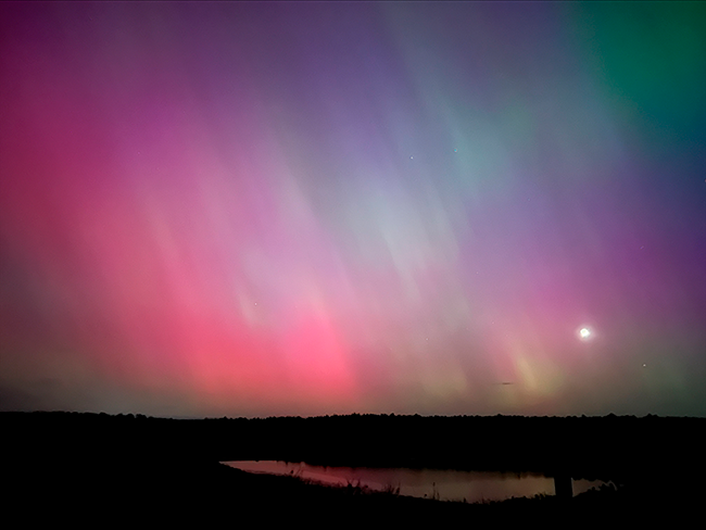 The Northern Lights over Reid State Park and reflecting off water. Photo by Park Manager Haylee Parsons.