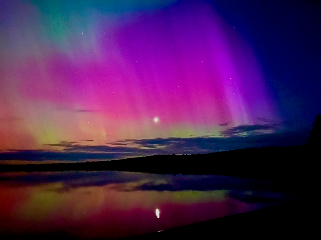 The Northern Lights over Lily Bay State Park with the Moon shining through. Photo by Park Manager Brian Fay.