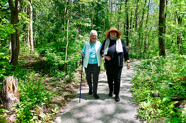 Two women enjoying the new accessible town trail to Fort St. Georges State Historic Site.