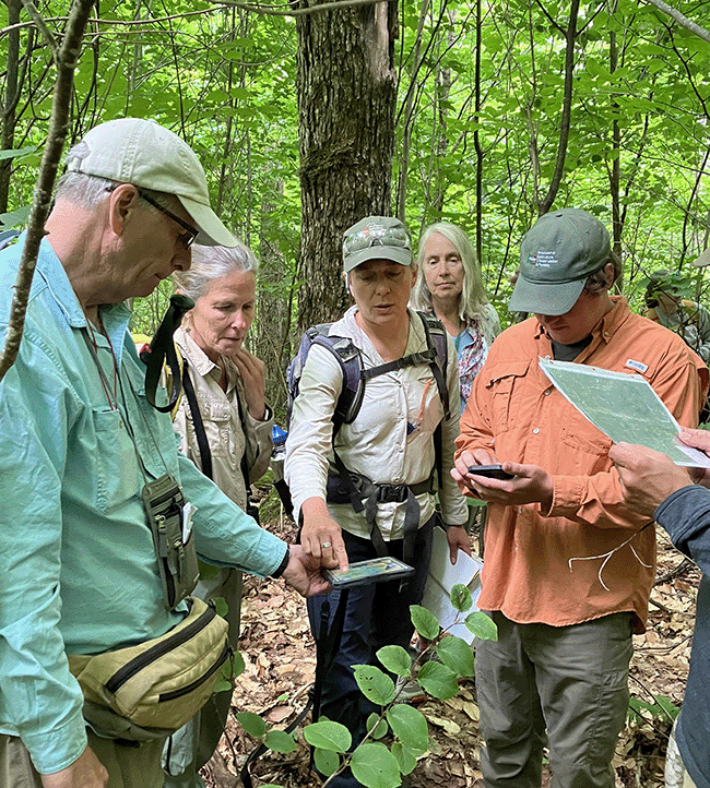 Dr. John Hagan joined MNAP staffers Molly Docherty and Kristin Puryear and others at Deboullie to look at old forest stands.