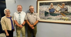 Adrienne Paiewonsky, artist Michael Vermette, and AWW Ranger, who is in the bow of the canoe in the watercolor.