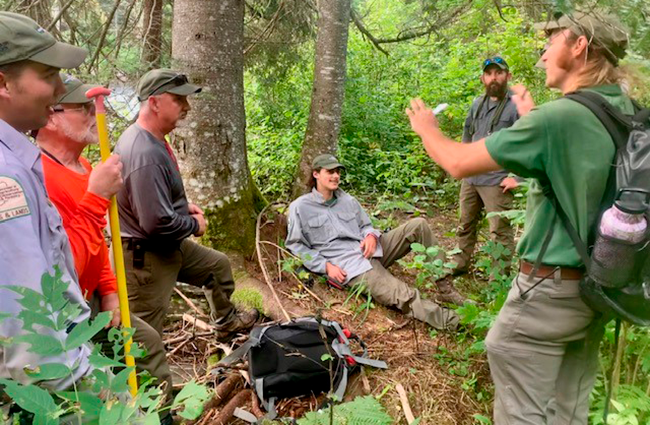 Allagash Wilderness Waterway (AWW) Ranger Keith Turdo explaining the steps of victim extraction from a remote waterway location to other AWW Rangers.