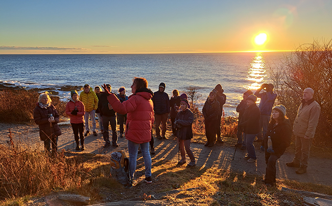 Participants enjoying a sunrise First Day Hike at Two Lights State Park with Jeanne Christie.