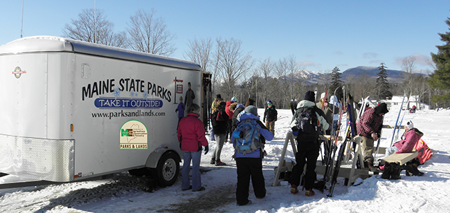 A Ski & Snowshoe Trailer loaning gear at a Maine State Park.