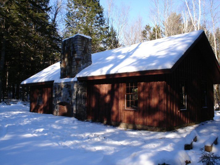 Megunticook cabin surrounded by snow at Camden Hills State Park.